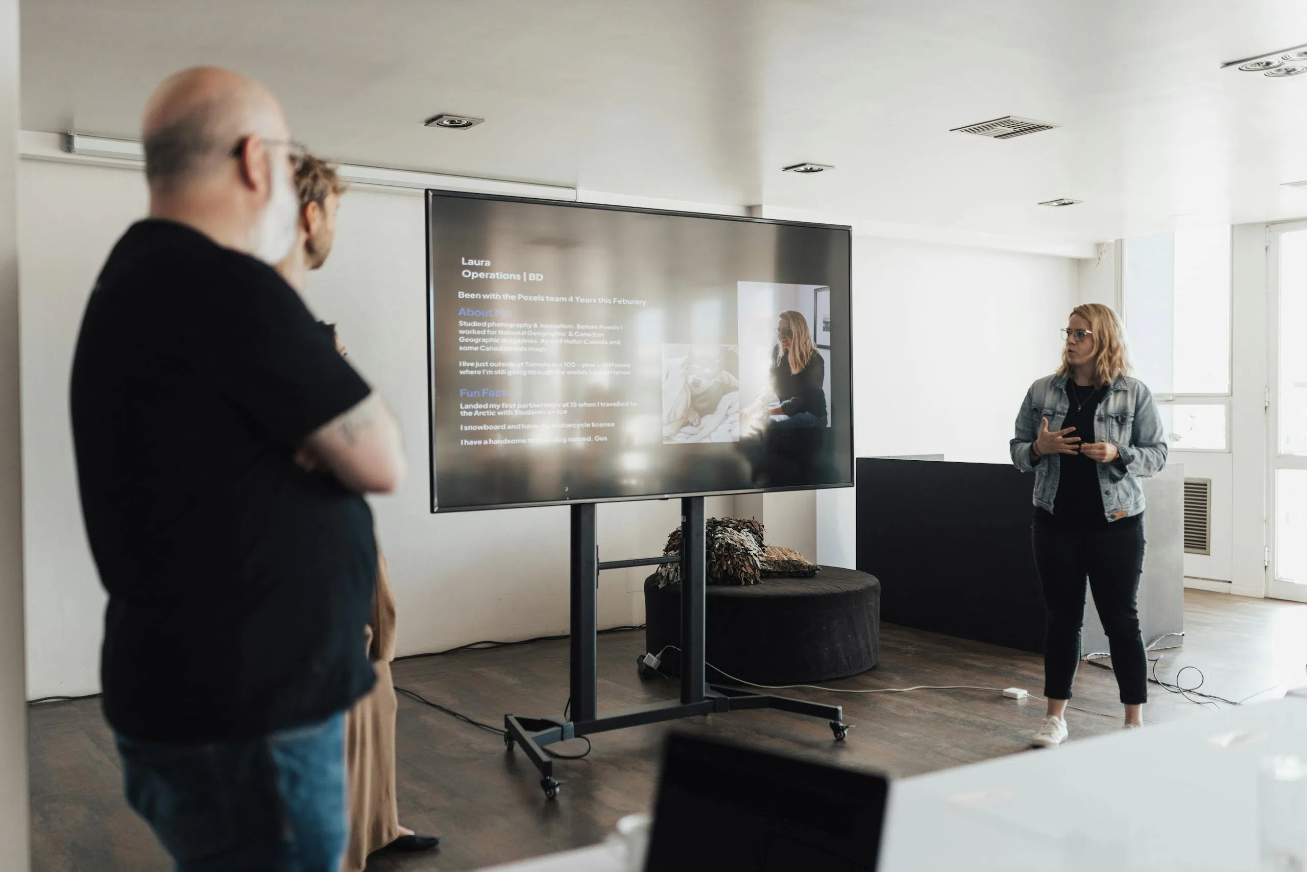 Business team engaged in a corporate presentation in a modern office space.